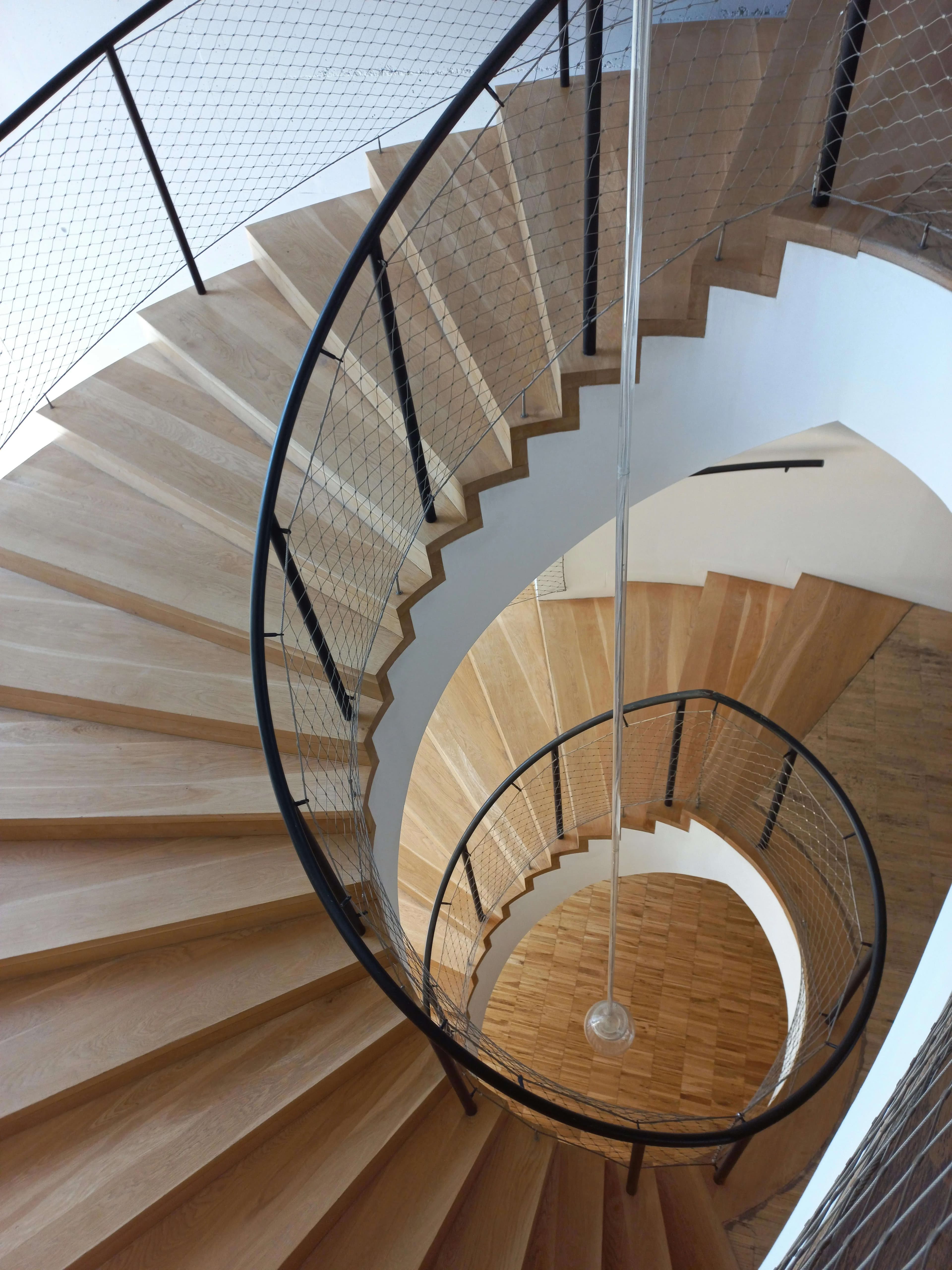 Spiral steel staircase application in an office interior